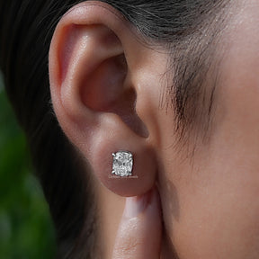 Close-ear view of old mine-cut diamond earrings  