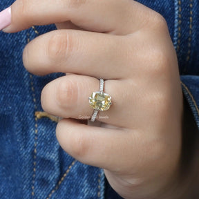 [In finger front view of yellow cushion cut moissanite ring set in four prongs]-[Golden Bird Jewels]