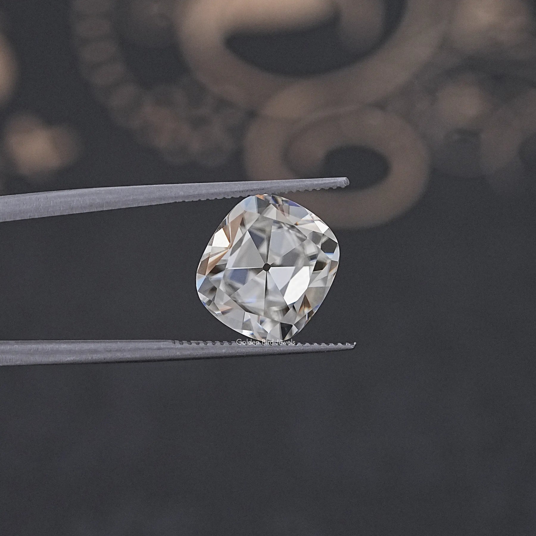 In Tweezer View Of Old Mine Cushion Cut Loose Moissanite Stone