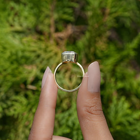Back View of Cushion Cut Moissanite Solitaire Engagement Ring In two fingers
