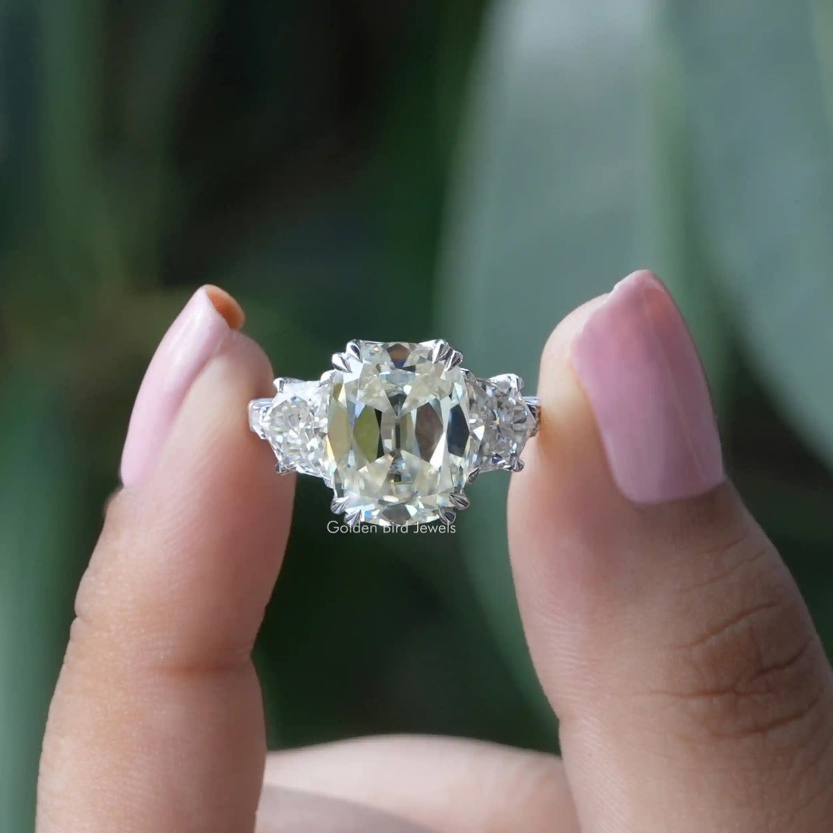 [in two finger front view of old mine cushion cut moissanite ring]-[Golden Bird Jewels]