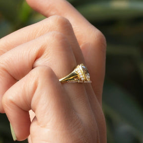 [In finger front view of 14k yellow gold cushion cut moissanite ring]-[Golden Bird Jewels]