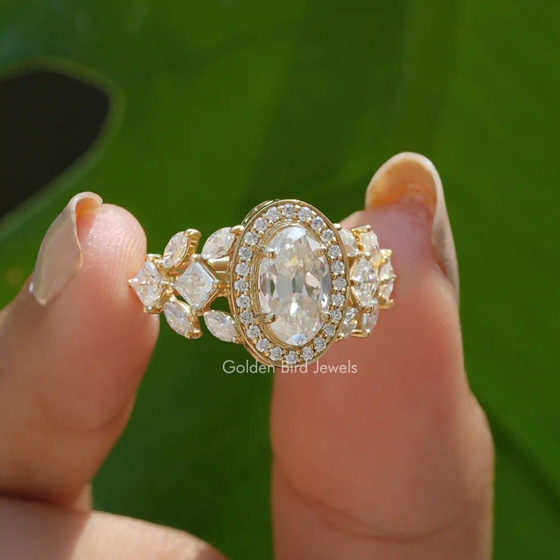 [Moissanite moval cut halo engagement ring crafted with side round cut stones]