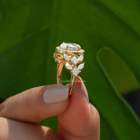 [Old mine moval cut moissanite ring set in marquise & round cut stones]