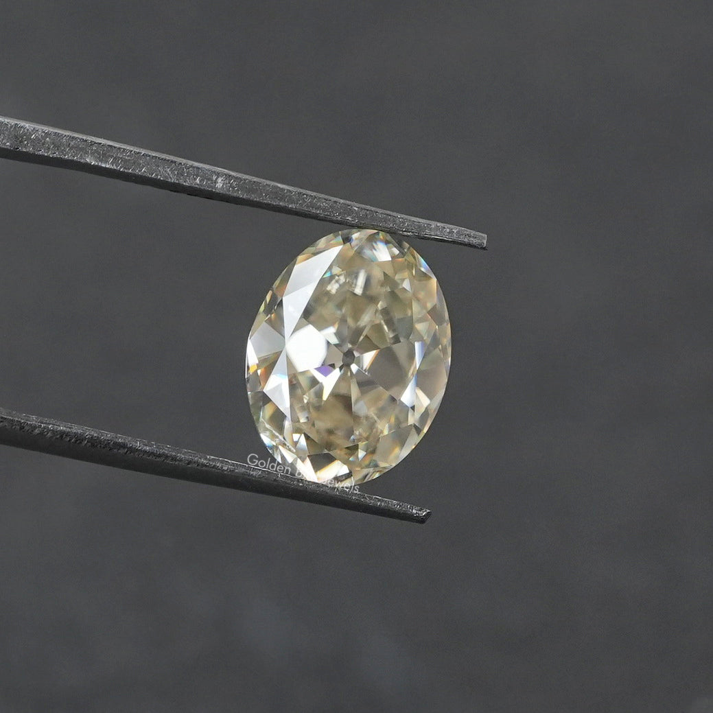 Tweezer view of White Old Mine Cushion Cut Loose moissanite 