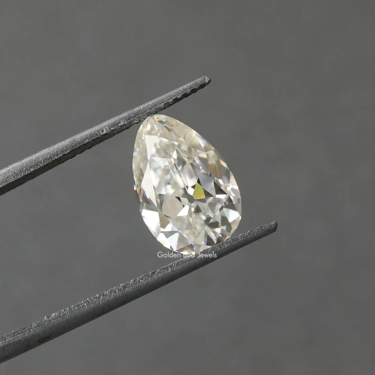 Tweezer view of Pear Shaped Loose Moissanite Stone