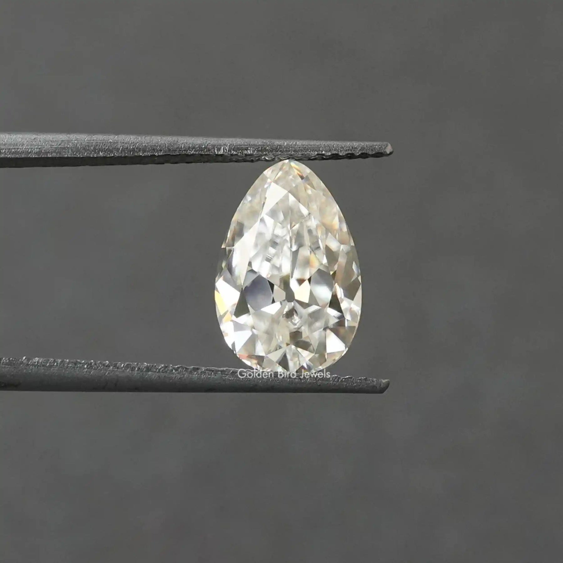 [Front view of pear shaped loose moissanite stone]-[Golden Bird Jewels]