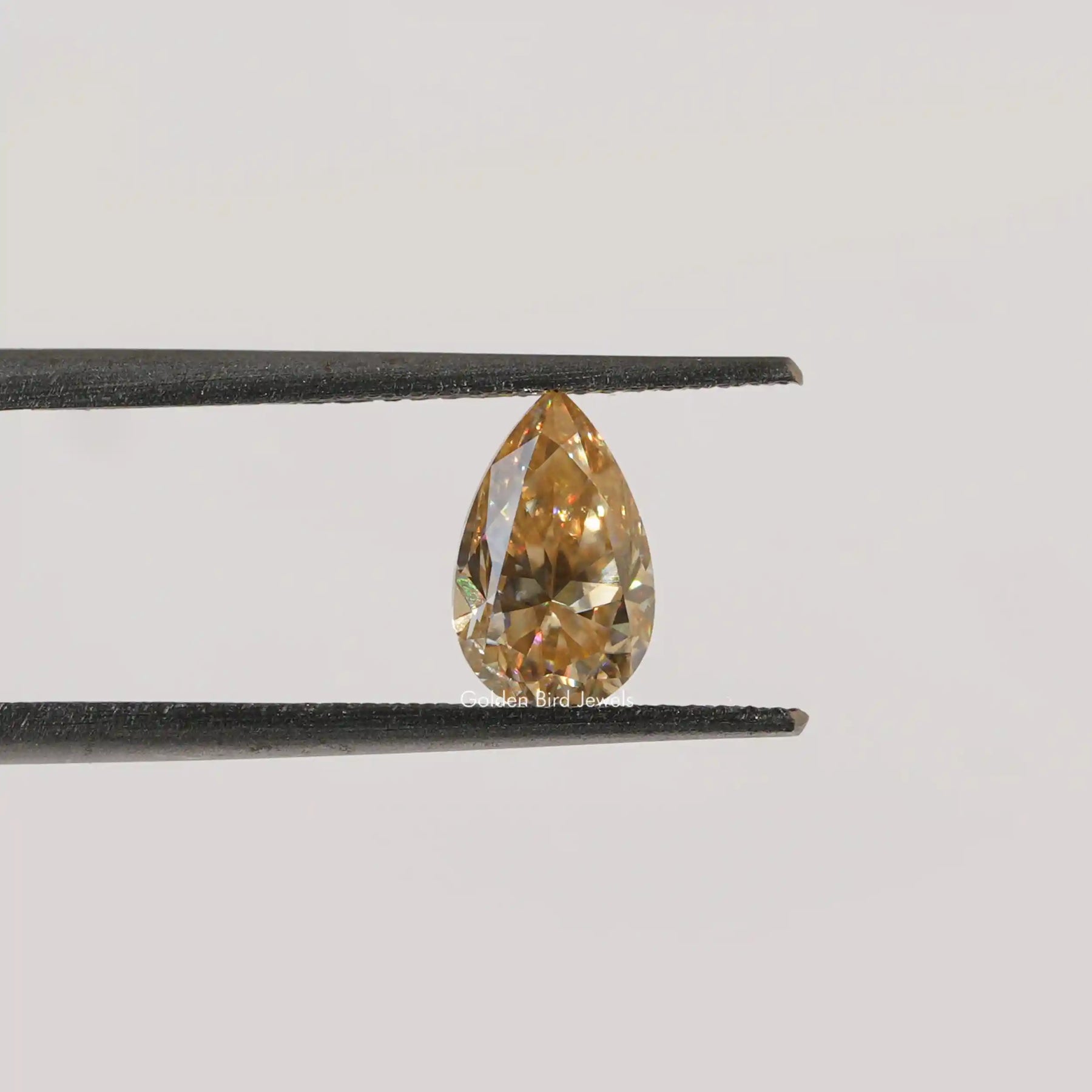[Front view of pear cut loose moissanite stone]-[Golden Bird Jewels]