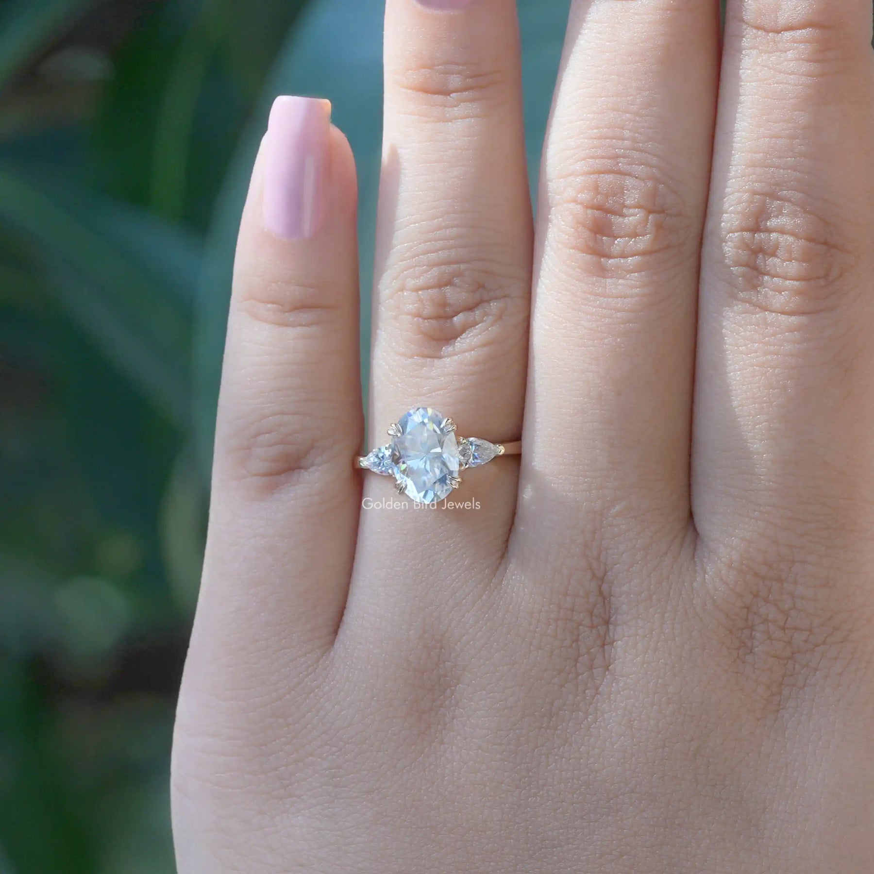 Oval And Pear Cut Moissanite 3 Stone Engagement Ring