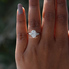 Detailed View Of Oval And Pear Cut Moissanite 3 Stone Ring In White Gold