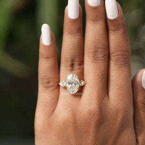 [In finger front view of three stone moissanite ring made of colorless color]-[Golden Bird Jewels]