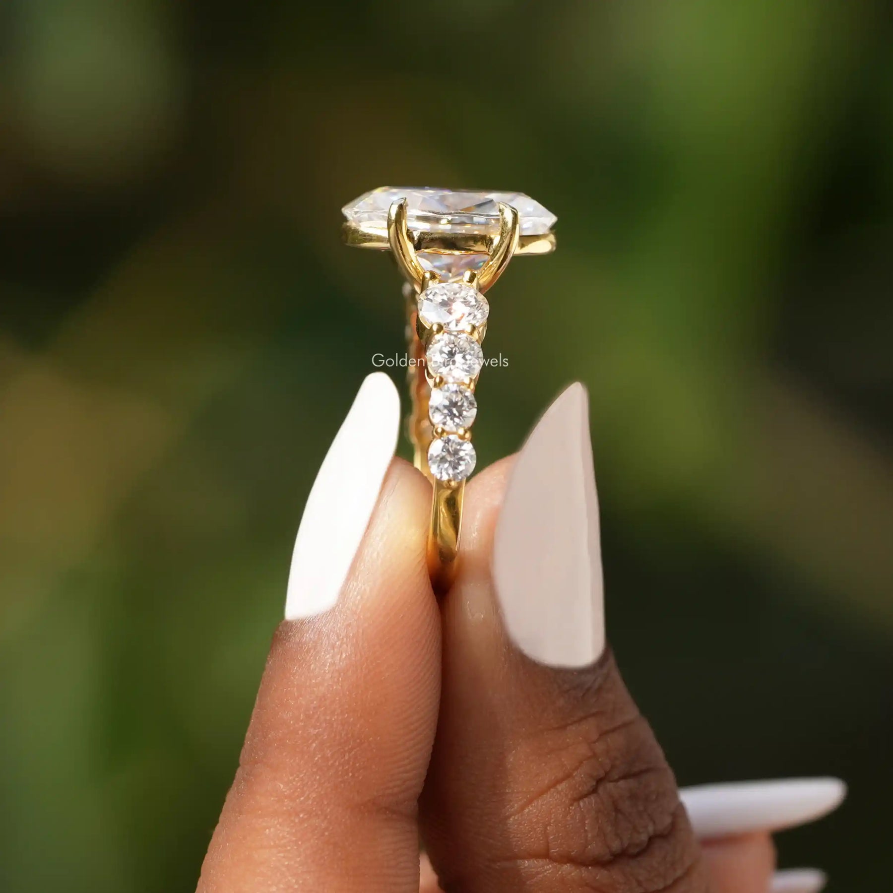 [Side view of oval cut moissanite engagement ring made of round cut side stones]-[Golden Bird Jewels]