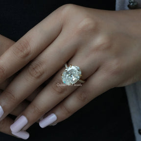 Close-Up View of Moissanite Oval Cut Engagement Ring In Yellow Gold