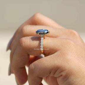 [In finger side view of hidden halo oval cut moissanite engagement ring in 14k yellow gold]-[Golden Bird Jewels]