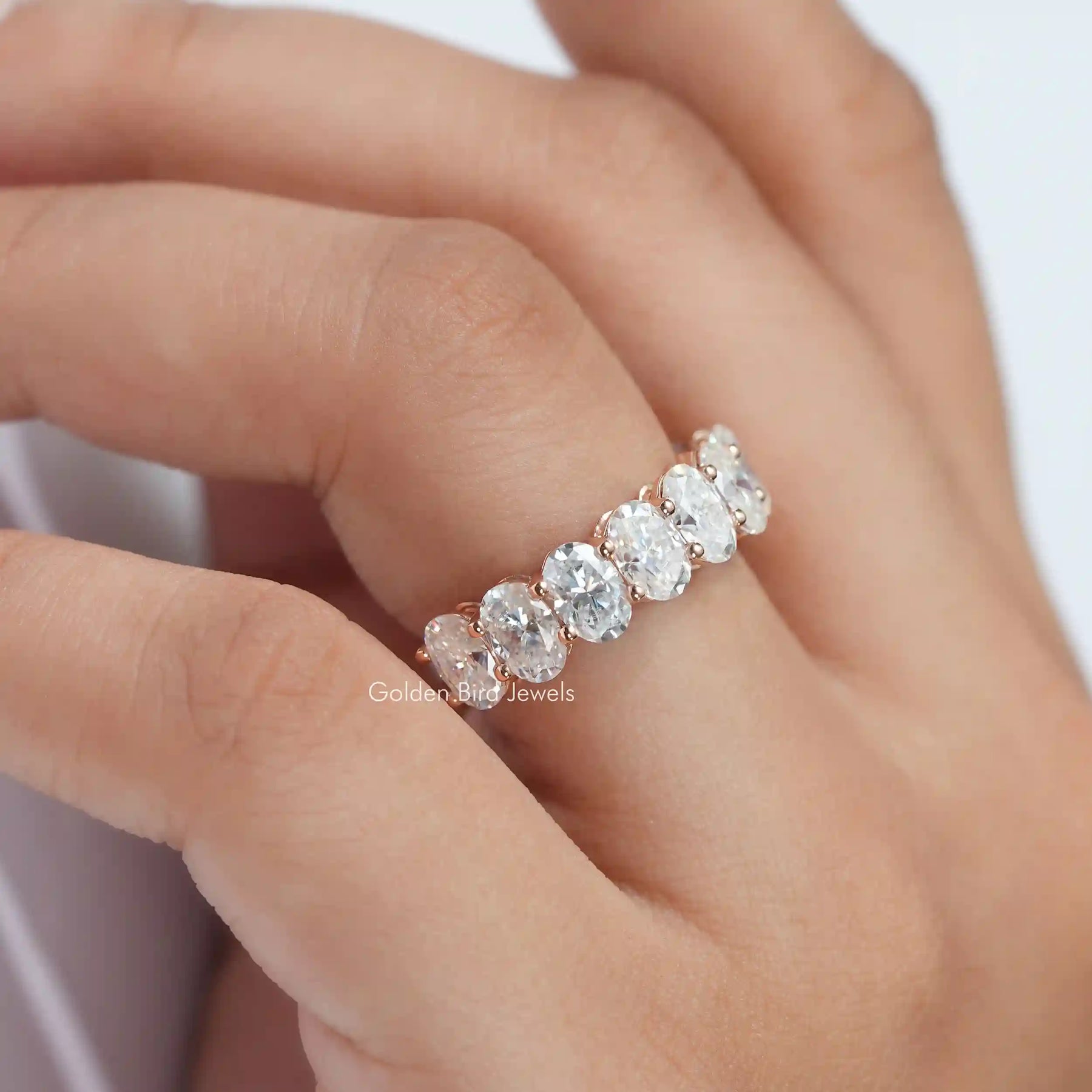 [Moissanite wedding bridal eternity band set in oval cut stones]