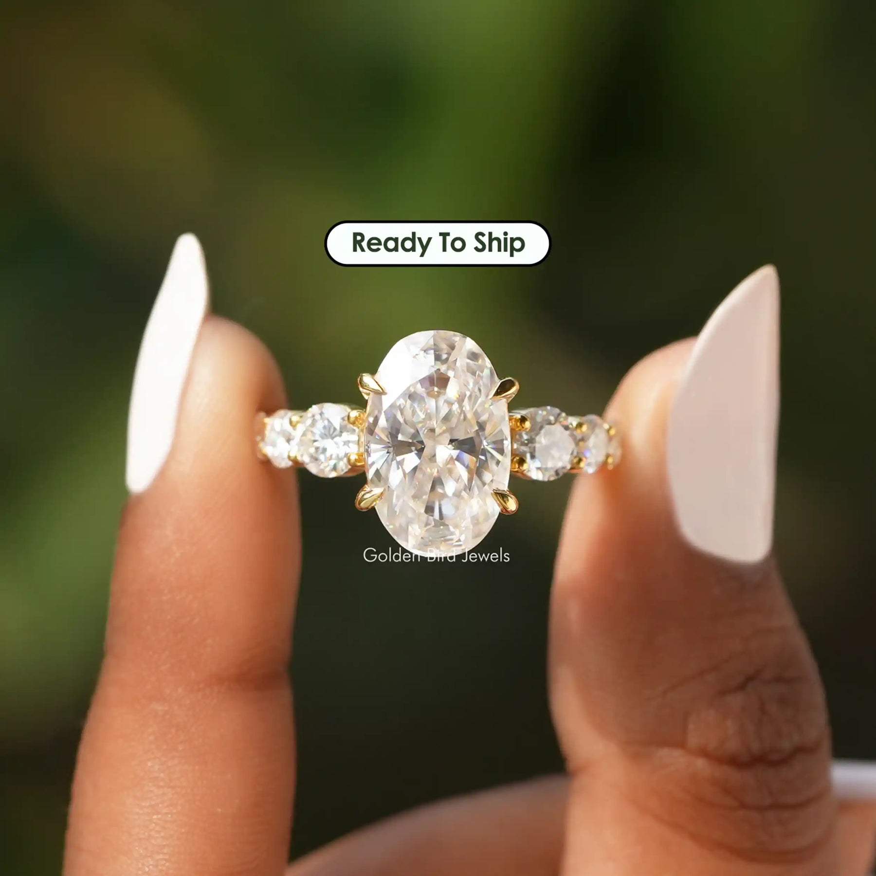 [Front view of oval and round cut moissanite engagement ring]-[Golden Bird Jewels]