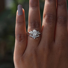 View of Moissanite Oval And Pear Cut Cluster Ring In finger