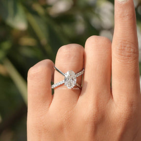[In finger front view of oval and round cut engagement ring made of round cut side stones]-[Golden Bird Jewels]