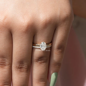 [In finger front view of oval cut solitaire moissaniyte ring]-[Golden Bird Jewels]
