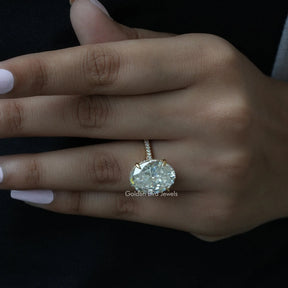 Oval Cut Solitaire Accent Stone Ring In finger