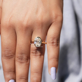 View of Oval Cut Moissanite Solitaire Ring In Yellow Gold