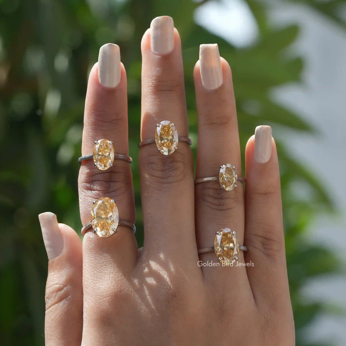 [Oval cut moissanite solitaire ring made in 14k yellow gold]