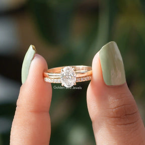 [In two finger front view of oval and round cut moissanite solitaire ring]-[Golden Bird Jewels]