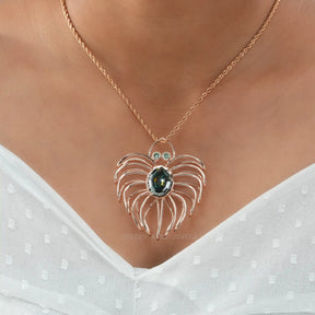 [In neck front view of oval cut moissanite pendant made of rose gold]-[Golden Bird Jewels]