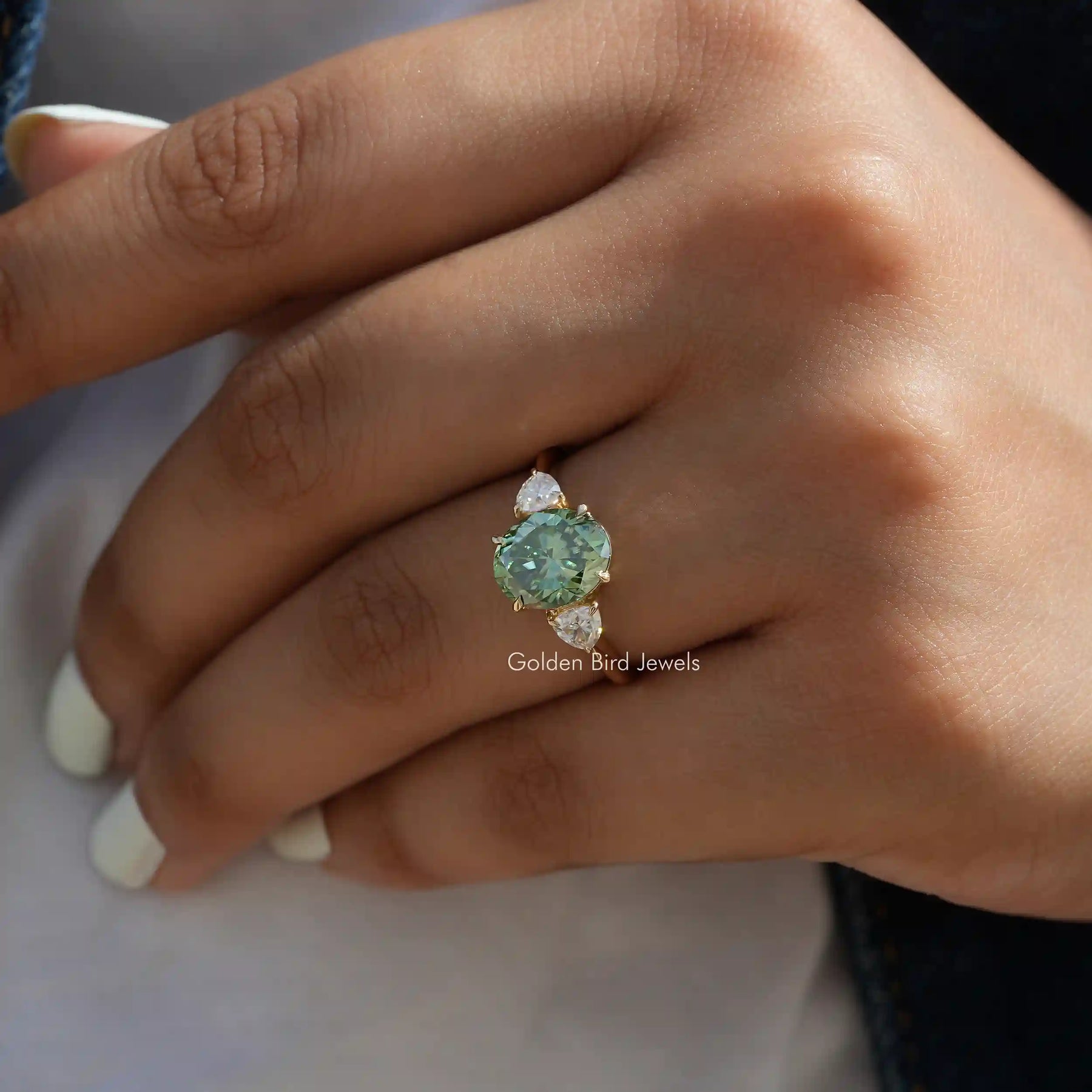 [This engagement ring crafted with green oval cut stone & trillion cut side stones]-[Golden Bird Jewels]