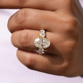 [In finger front view of moissanite oval and roiund cut engagement ring]-[Golden Bird Jewels]