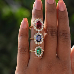 View of Oval Cut Gemstone Halo Engagement Ring In finger