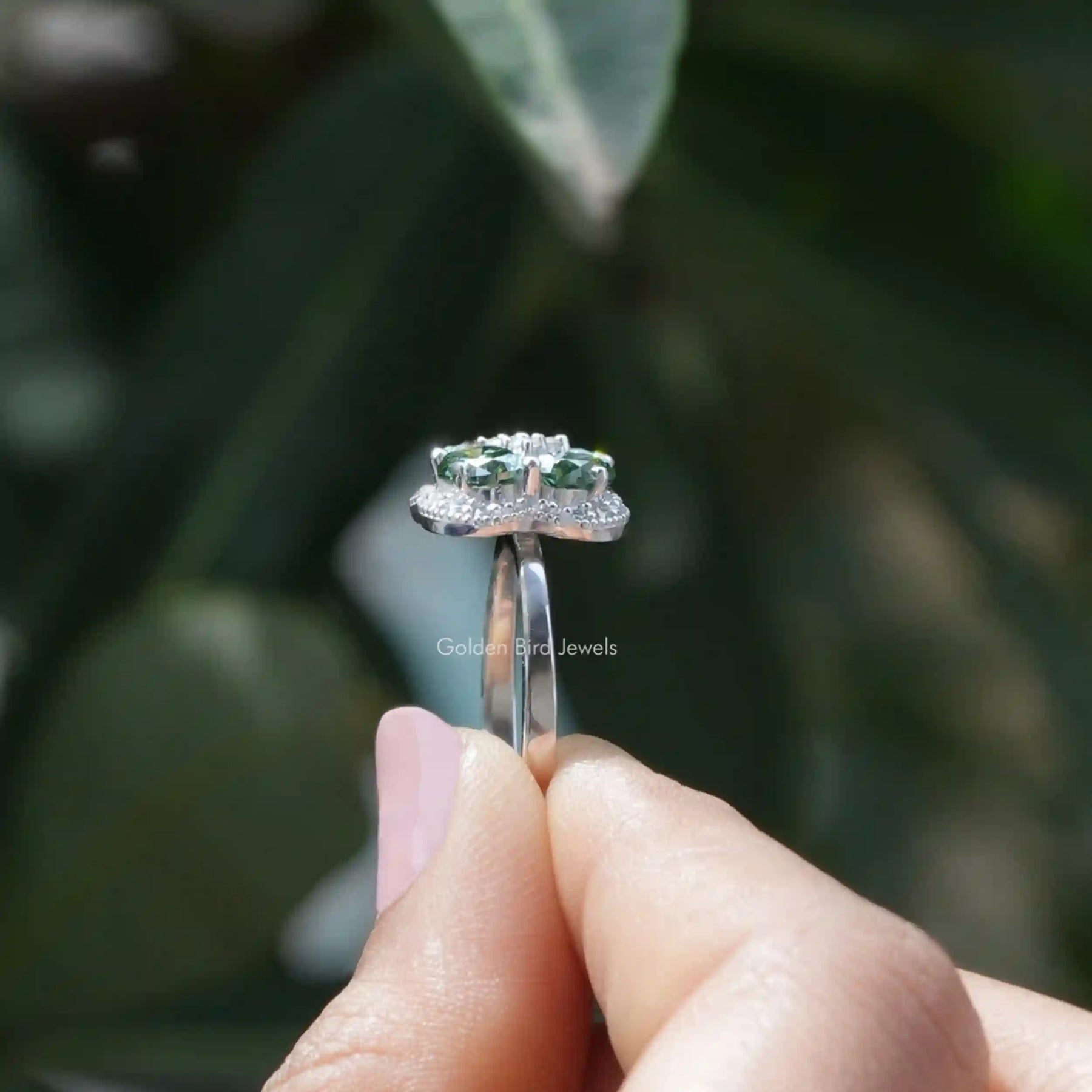 [Side view of oval cut halo moissanite engagement ring]-[Golden Bird Jewels]
