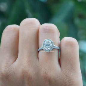 [In finger front view of oval halo solitaire engagement ring]-[Golden Bird Jewels]