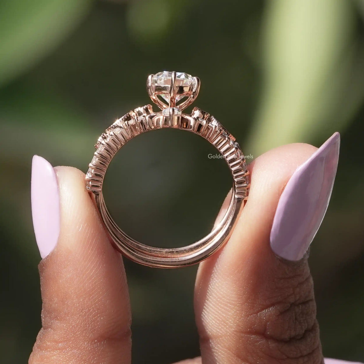 Back View of Oval Cut Bridal Ring With Chevron Band In two fingers
