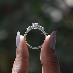 Back View of Oval Cut Moissanite Cluster Ring In two fingers
