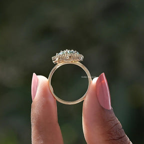 Back View of Oval Cut Moissanite Engagement Ring In two fingers