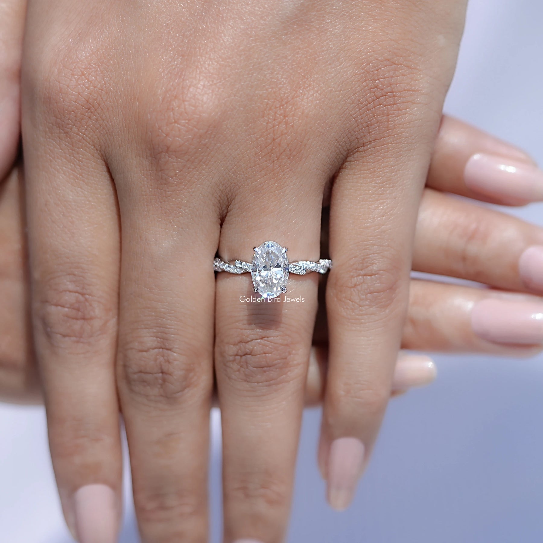 Oval Shaped Moissanite Twisted Shank Accent Ring