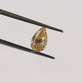 Twijer holding On Pear Cut Moissanite Loose Stone  