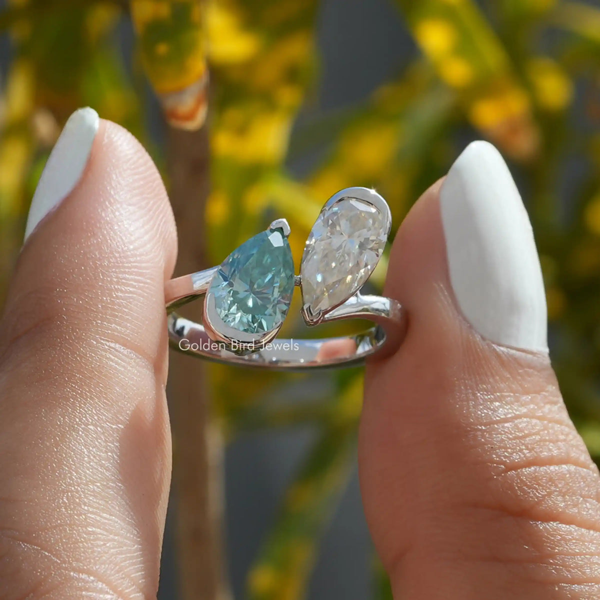 Front view of 2 pear Moissanite engagement ring