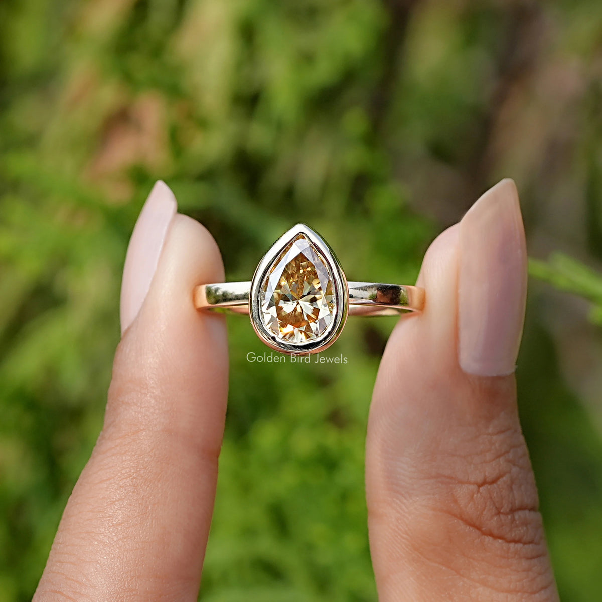 View Of Pear Cut Yellow Moissanite Bezel Set Solitaire Ring