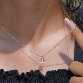 Side view of Pear Cut pendant In yellow Gold