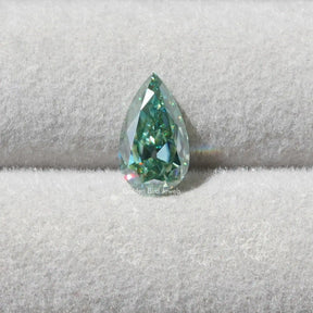 [Front view of blue green pear shaped moissanite loose stone]-[Golden Bird Jewels]