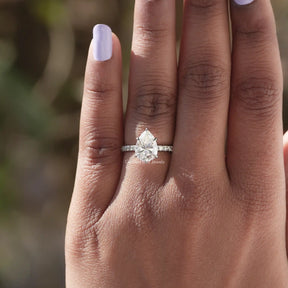 [In finger front view of pear cut moissanite ring crafted with white gold and VVS clarity]-[Golden Bird Jewels]