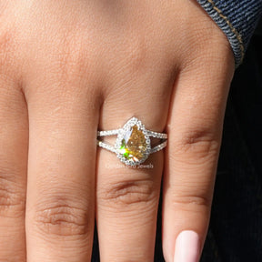 [In finger front view of pear shaped moissanite ring made of yellow color]-[Golden Bird Jewels]