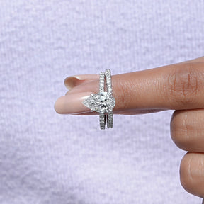 In finger front view of Pear Shaped Wedding Ring Set