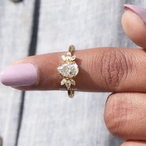 In finger front View of Pear And Marquise Cut Engagement Ring