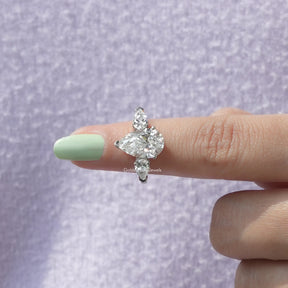 In finger front View of 3 Stone Pear Cut Diamond Ring