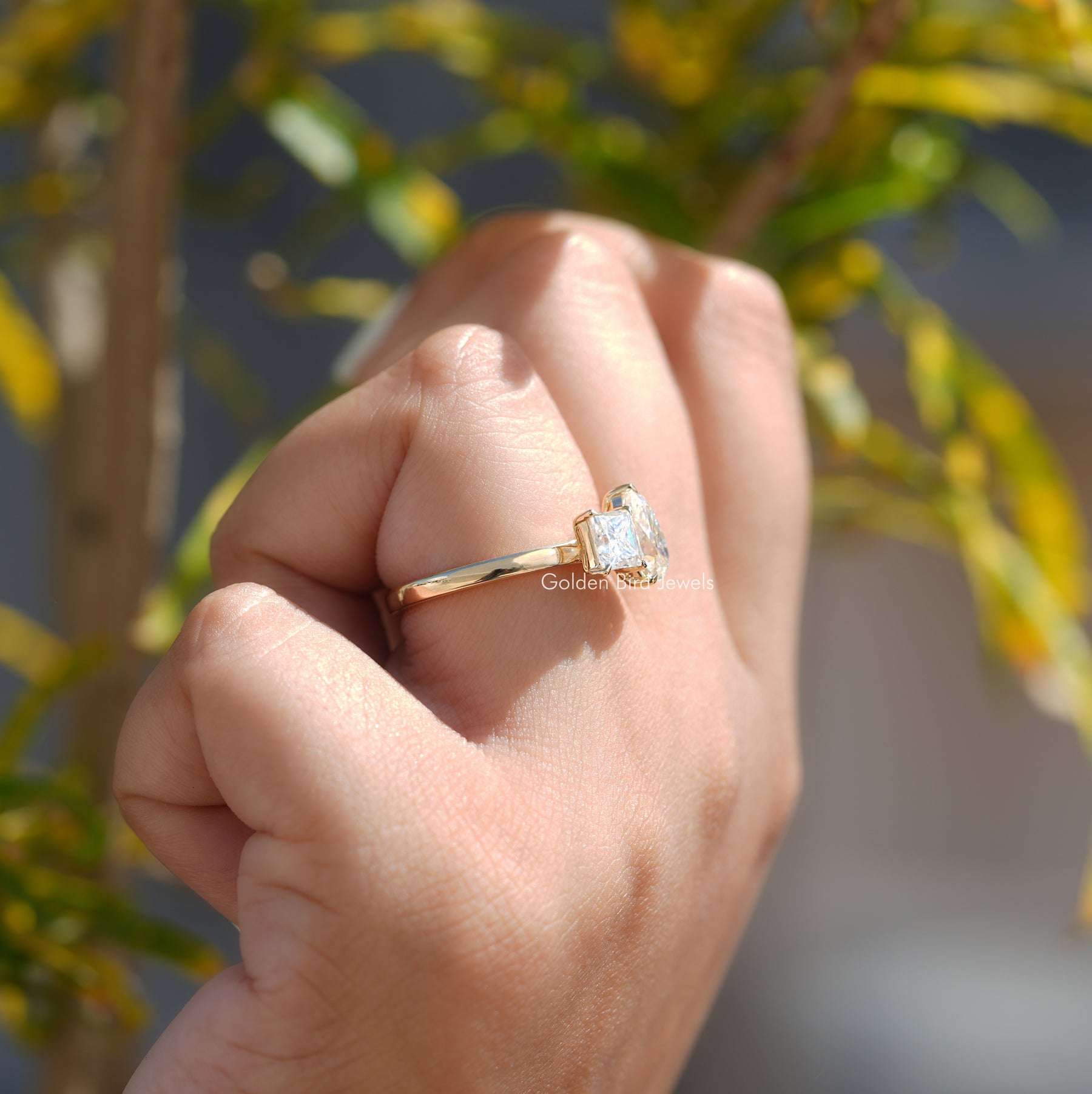 [In Finger Side View Of Moissanite Toi Et Moi Engagement Ring]-[Golden Bird Jewels]