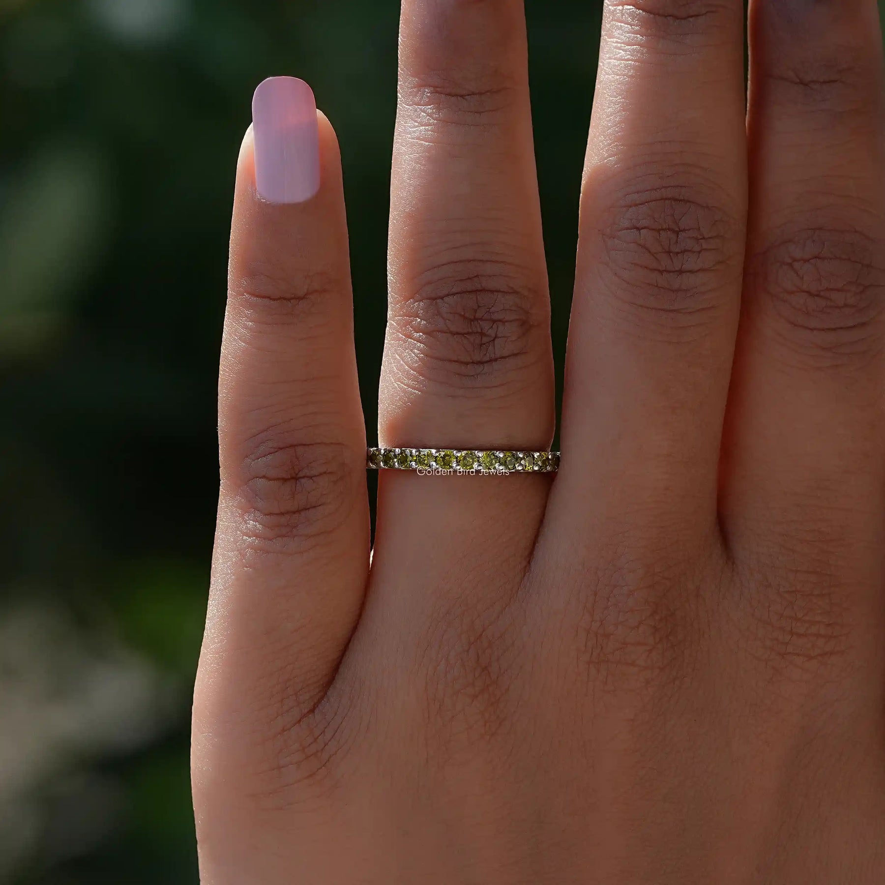 Close view of Green Round Eternity Band