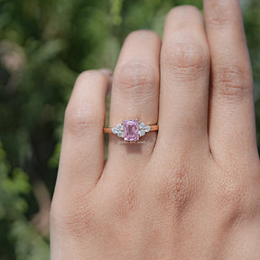 In finger view of Pink Emerald Cut Moissanite Solitaire Ring